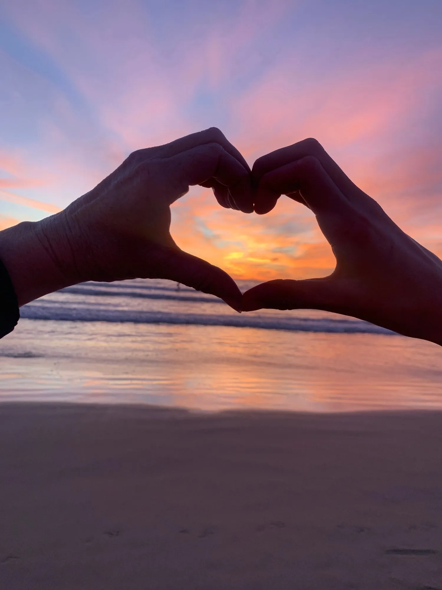 A frame made by two hands. A beach observation made in the changing evening light.