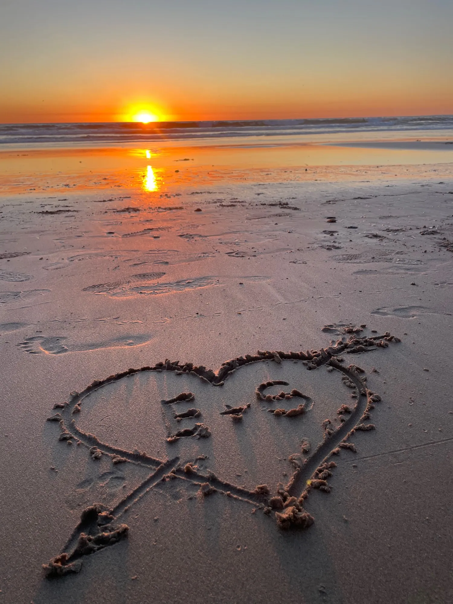 A heart drawn in wet sand. A beach observation made in the changing evening light.