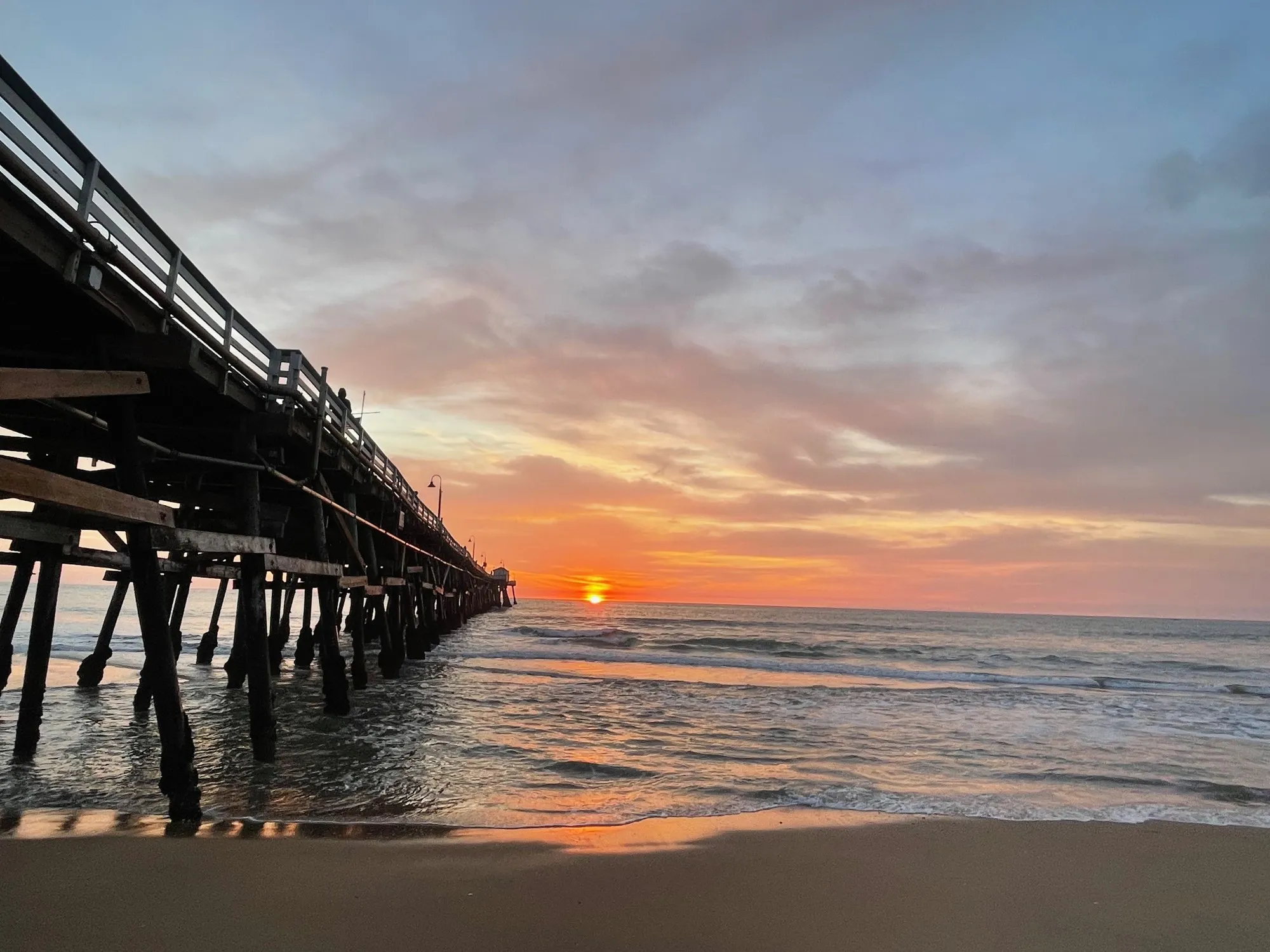 The pier in the last light. A beach observation made in the changing evening light.
