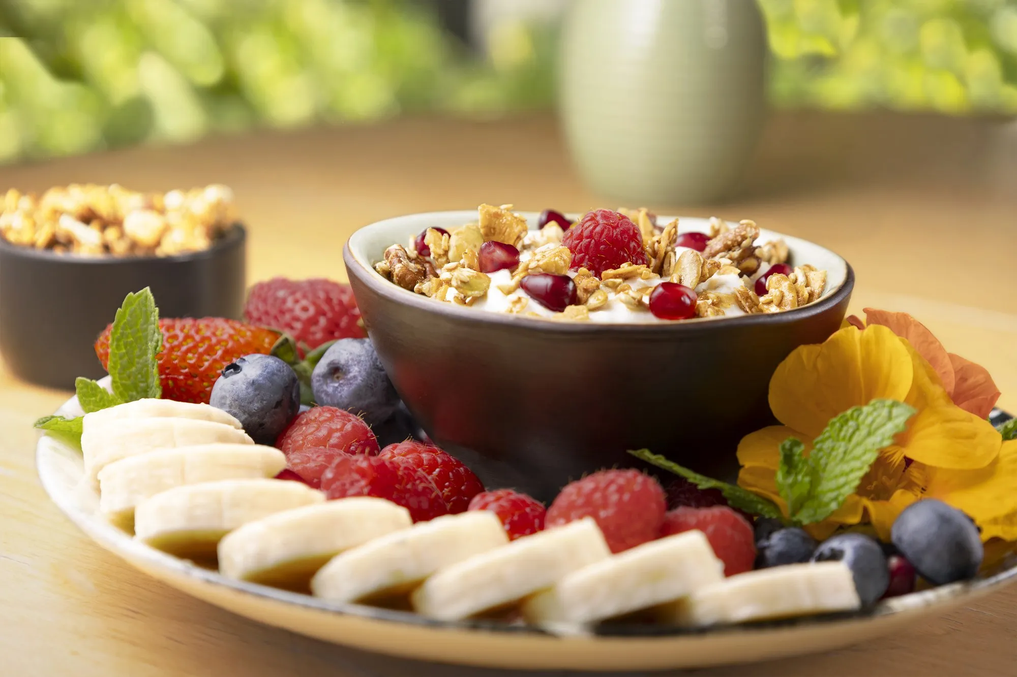 A breakfast bowl with berries and fruit on a tabletop