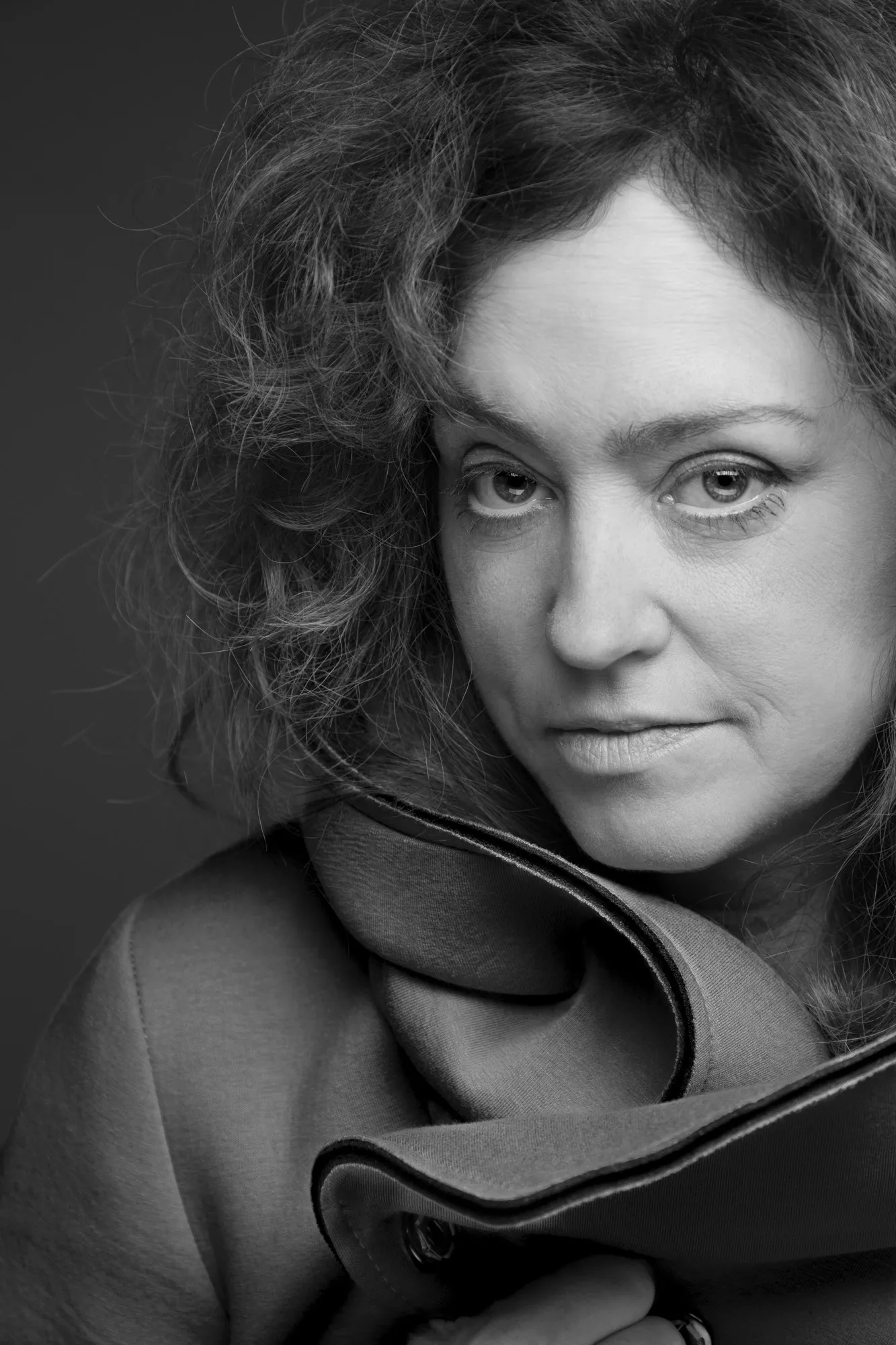 Rachel looks toward the camera in a black-and-white portrait.