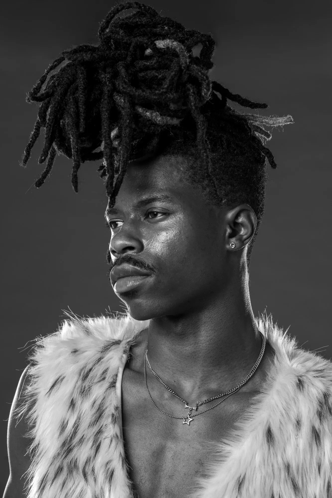 Tray in a black-and-white fashion portrait.
