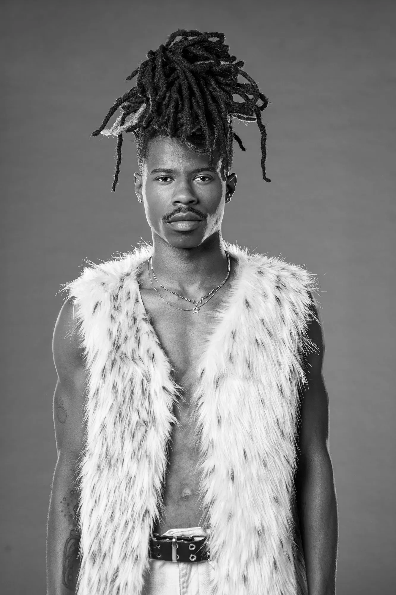 Tray poses in a black-and-white portrait.