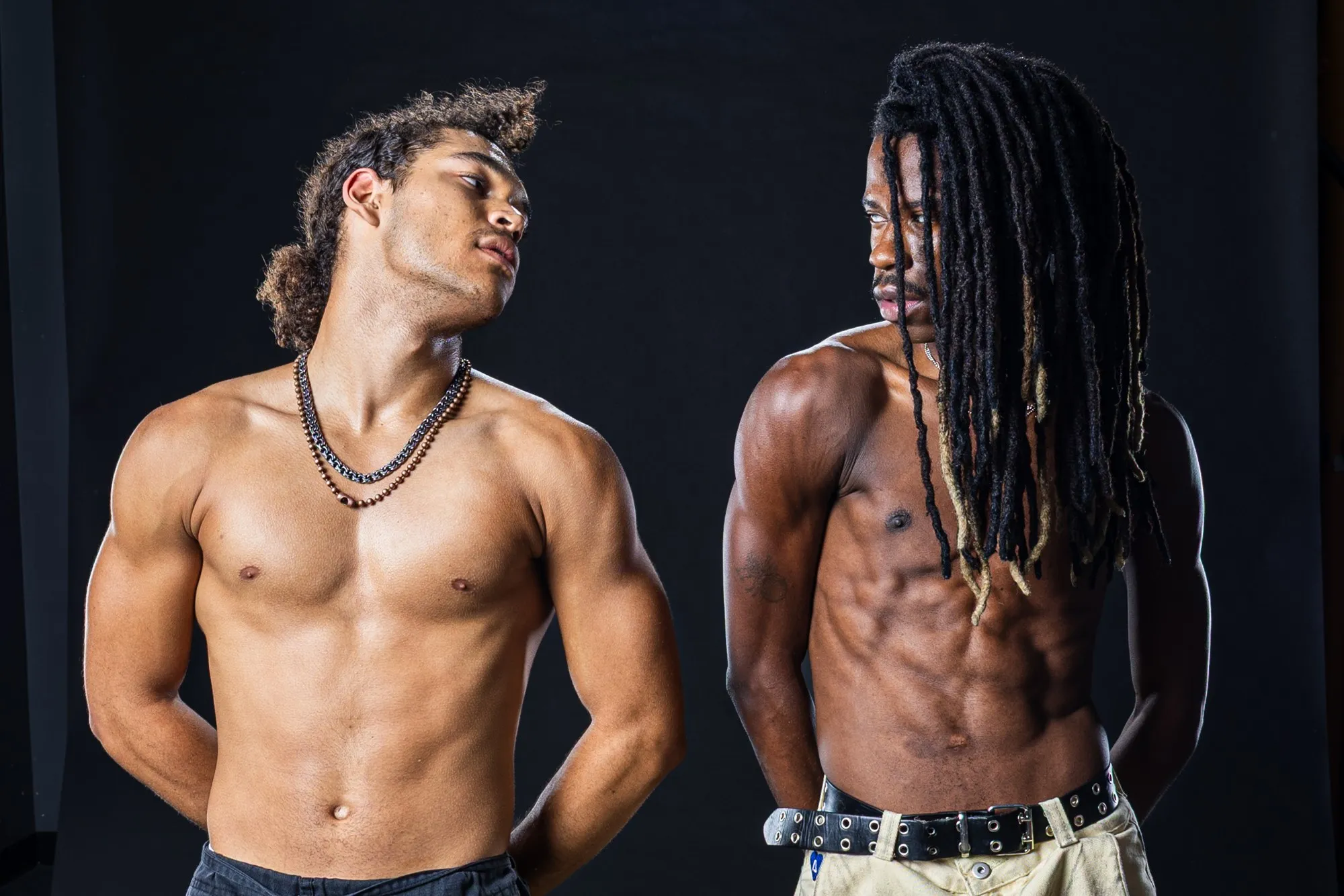 Tray and a partner perform under studio light.